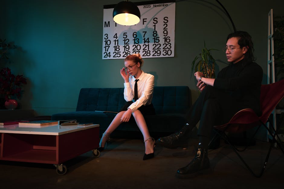 A stylish duo in a modern room with a November 2025 calendar in the background.